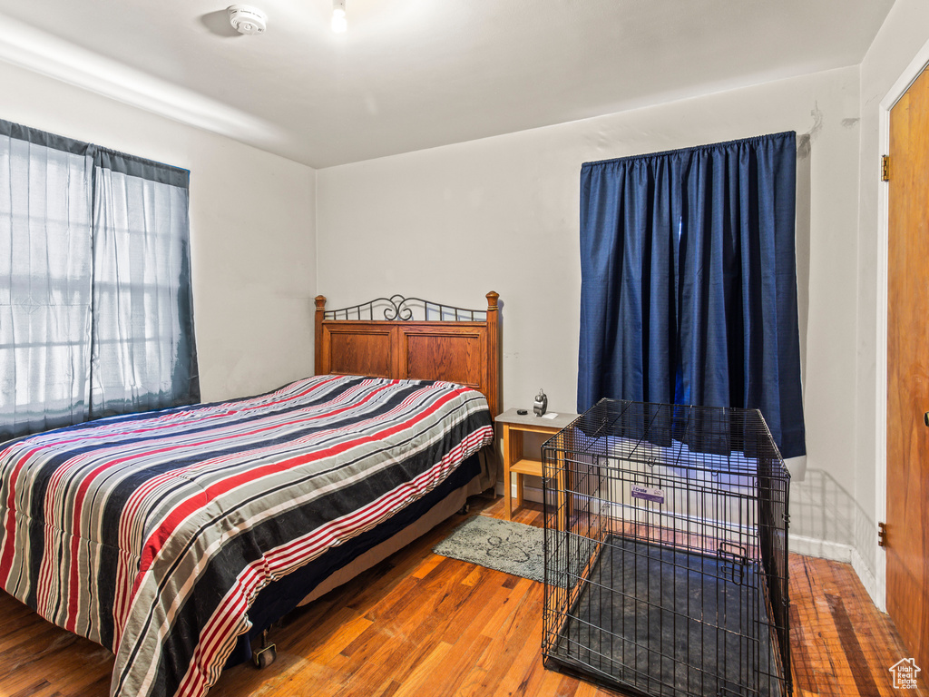 Bedroom featuring wood-type flooring