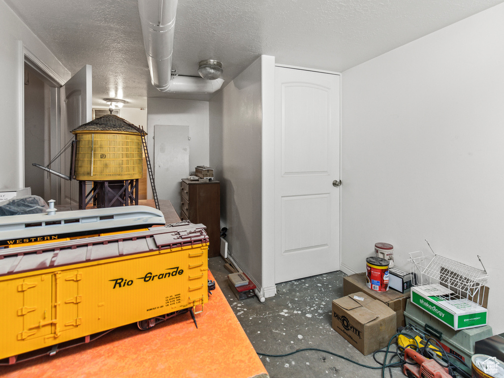 Bedroom with a textured ceiling