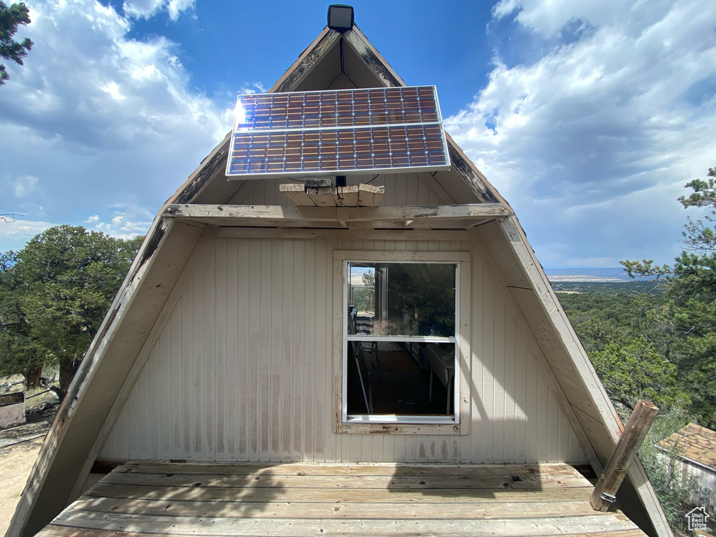 View of side of home with a deck