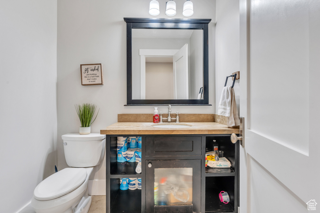 Bathroom featuring vanity and toilet