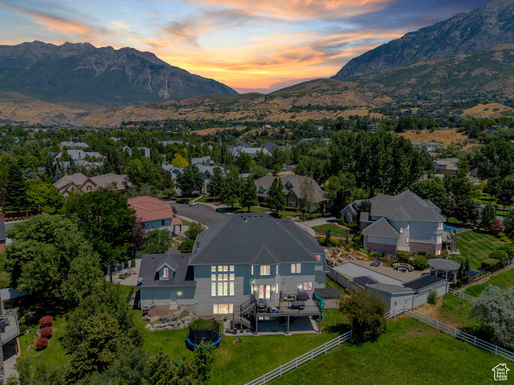 Aerial view at dusk featuring a mountain view