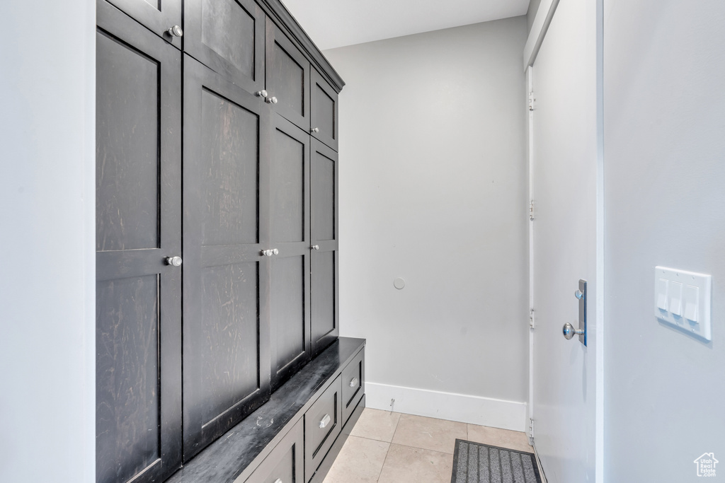 Mudroom featuring light tile patterned floors