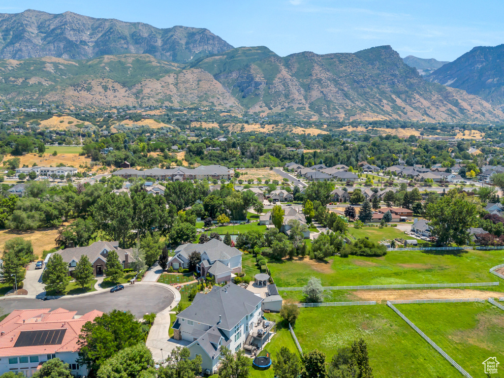 Birds eye view of property with a mountain view