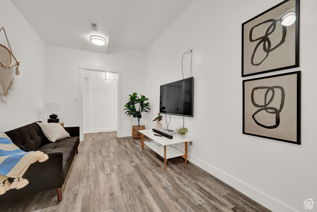 Living room with light hardwood / wood-style flooring