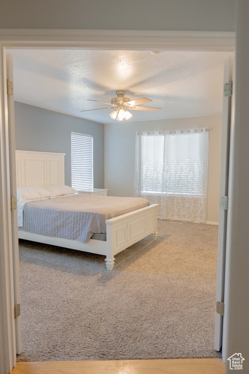 Bedroom with carpet and ceiling fan