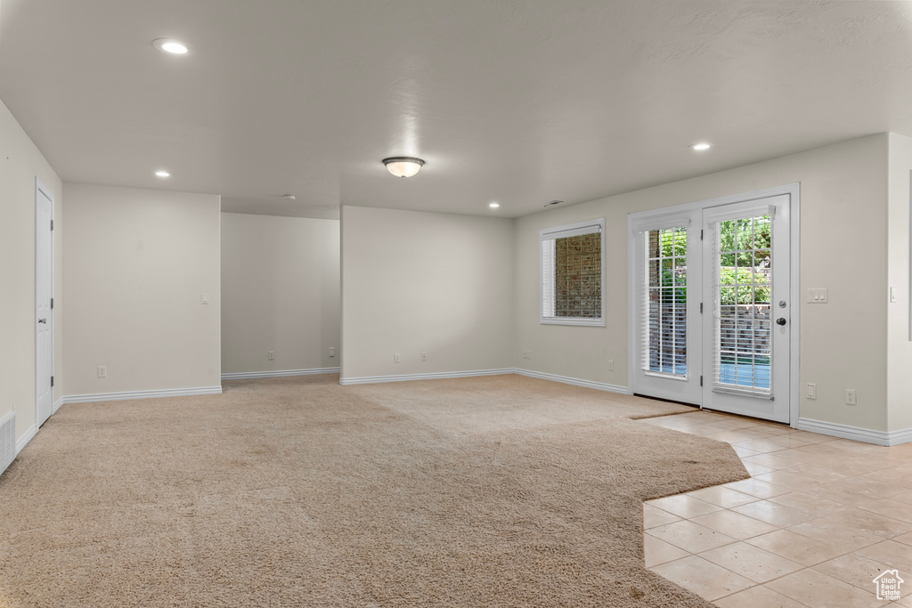 Unfurnished room with light colored carpet