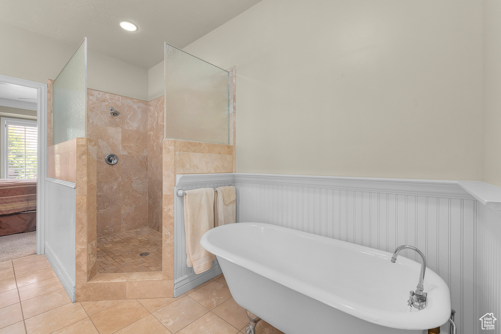 Bathroom featuring plus walk in shower and tile patterned flooring