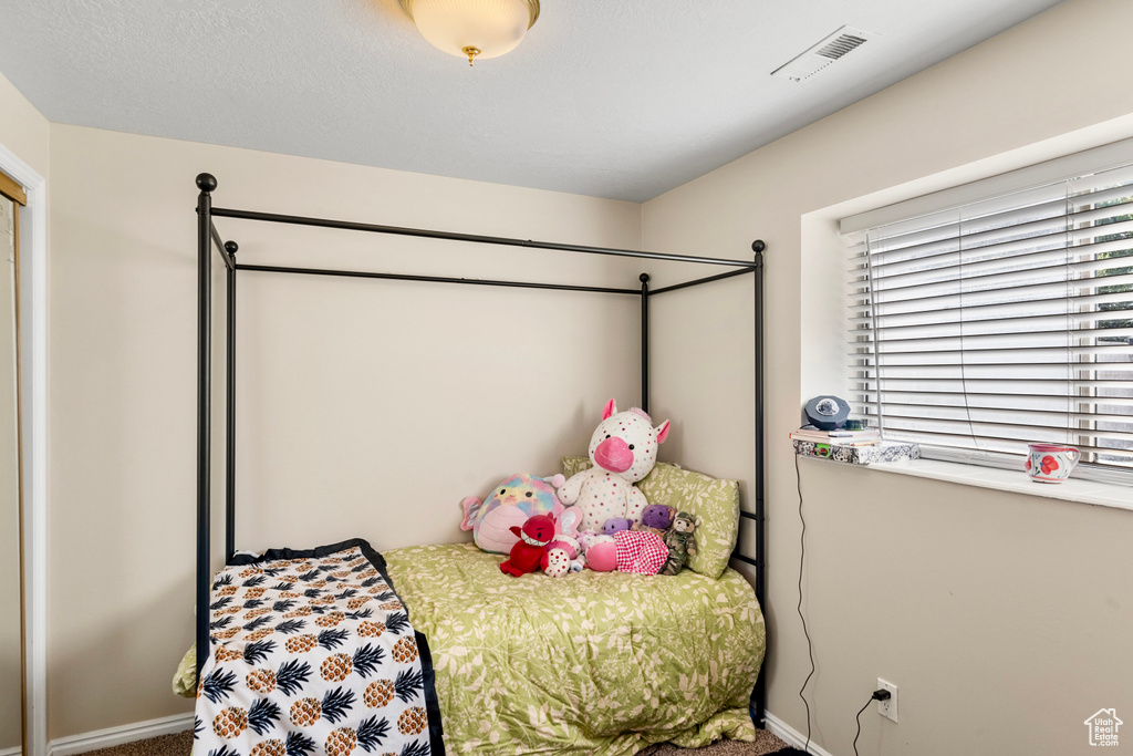 Bedroom featuring carpet