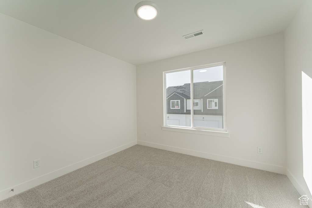 Empty room featuring carpet floors