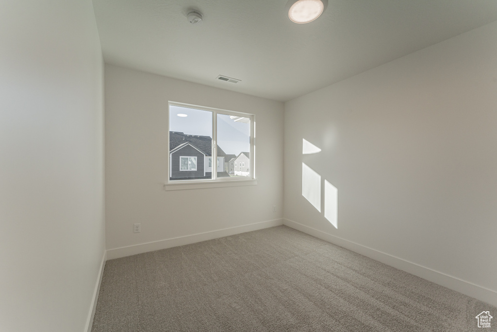 Unfurnished room featuring carpet flooring