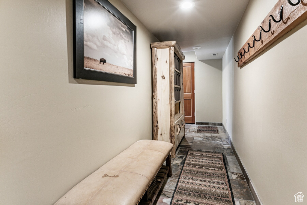 Corridor featuring tile patterned floors