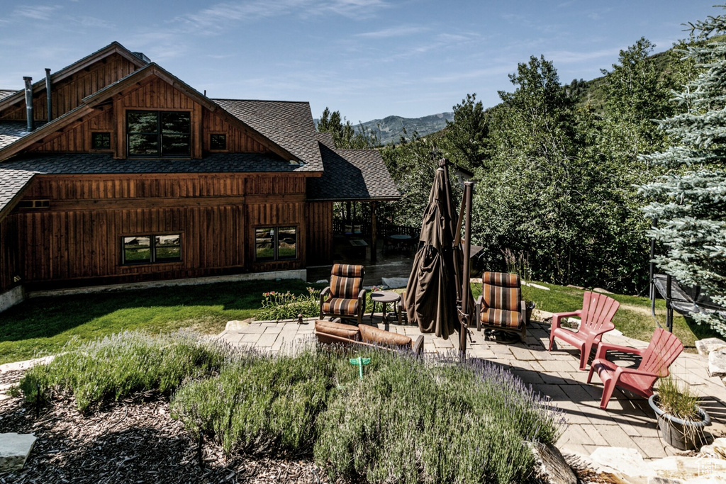 View of yard featuring a mountain view and a patio area