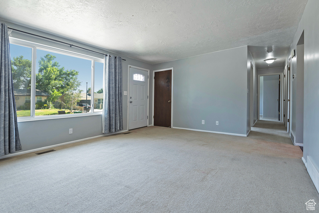 Interior space featuring a textured ceiling