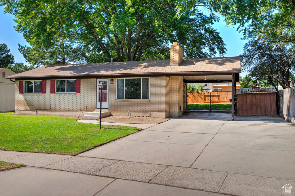 Single story home featuring a front yard