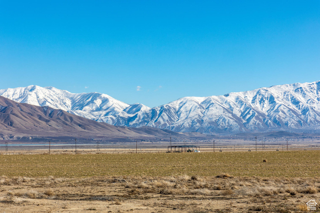 Property view of mountains with a rural view