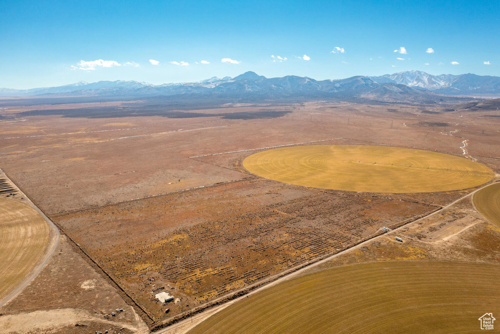 Birds eye view of property with a mountain view and a rural view