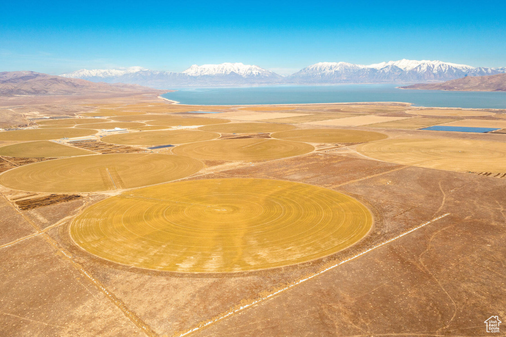 Birds eye view of property featuring a water and mountain view