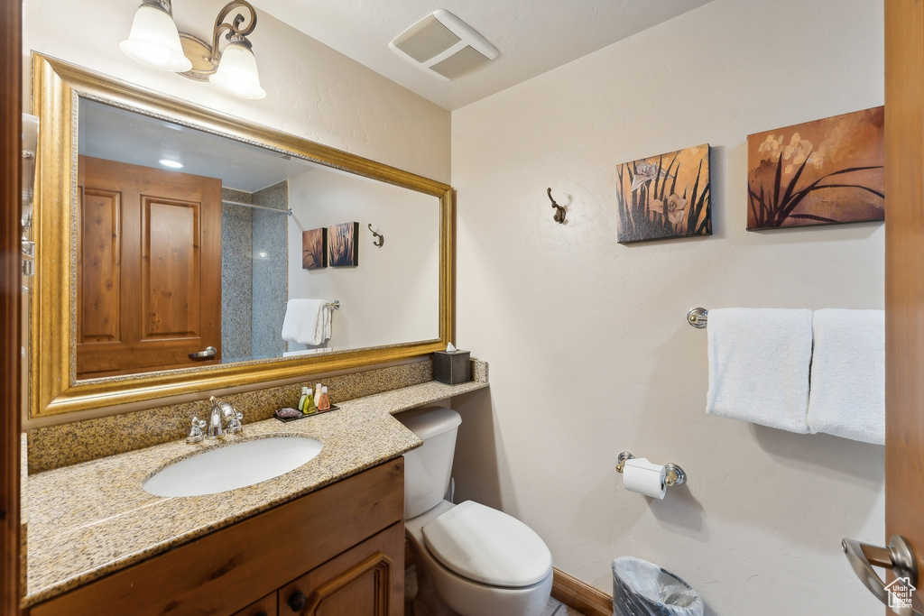 Bathroom with vanity and toilet