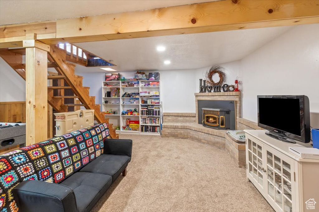 Living room with carpet floors and beam ceiling