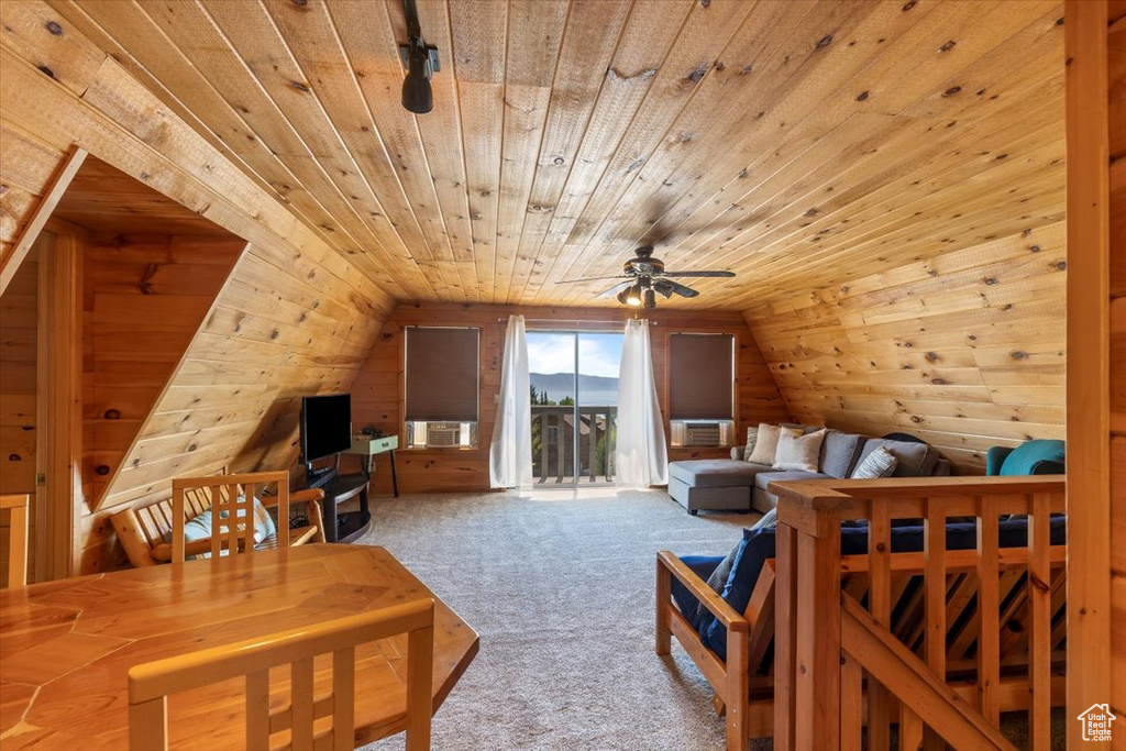 Bedroom featuring wood ceiling, lofted ceiling, and light colored carpet