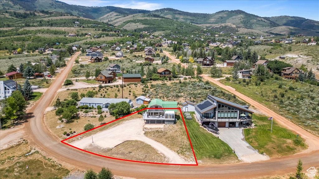 Birds eye view of property with a mountain view