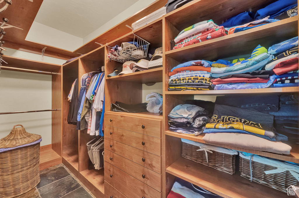 Walk in closet with tile patterned floors