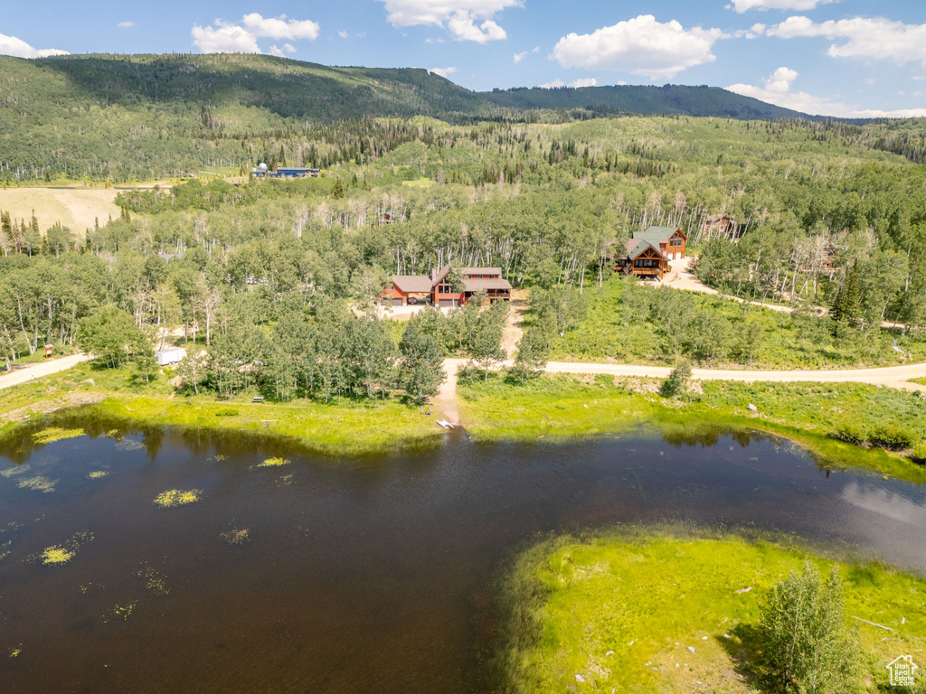 Bird\'s eye view with a water and mountain view