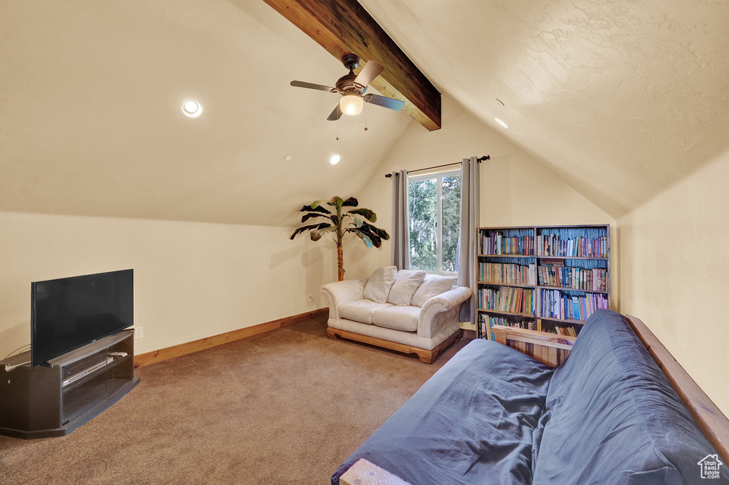 Living room with carpet flooring, ceiling fan, and vaulted ceiling with beams