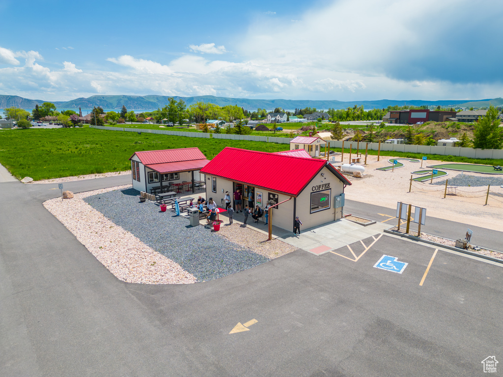 Birds eye view of property with a mountain view