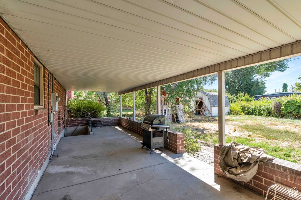 View of patio featuring area for grilling