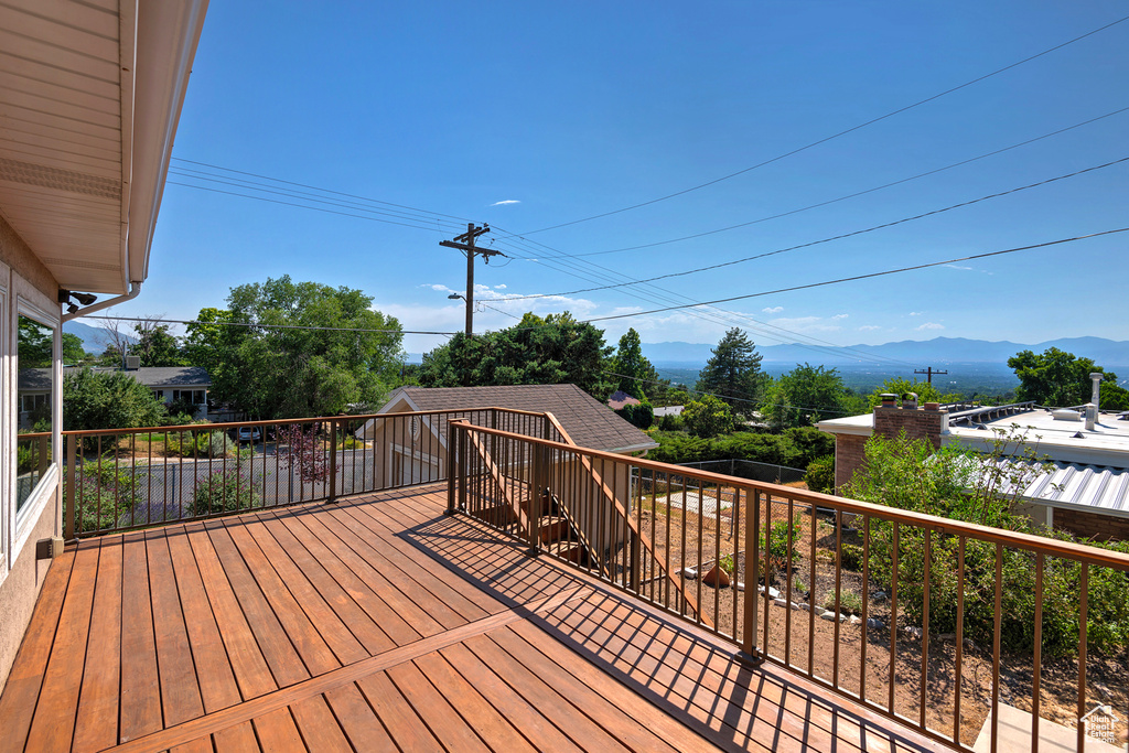 Wooden deck featuring a mountain view