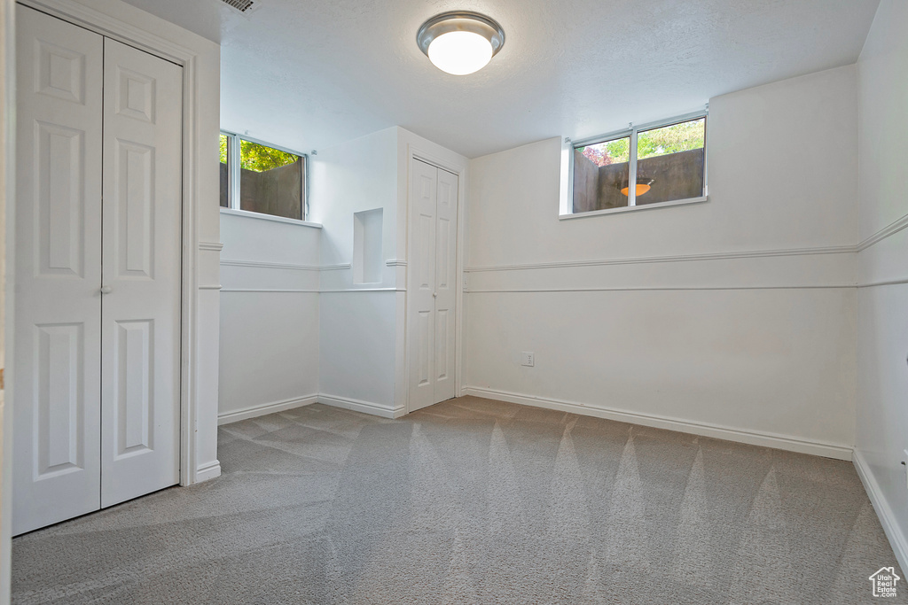 Unfurnished room featuring carpet