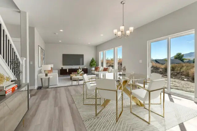 Dining area with hardwood / wood-style flooring and a chandelier