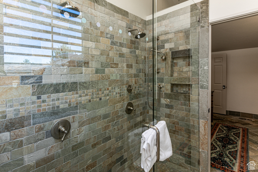 Bathroom featuring a shower with shower door