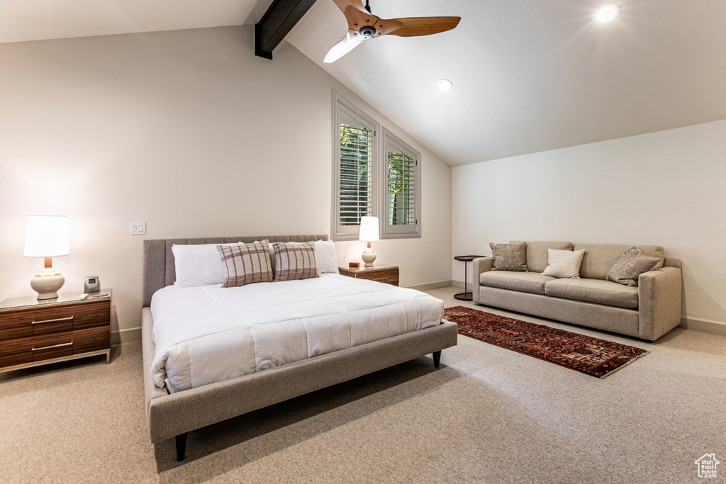 Bedroom featuring carpet, lofted ceiling with beams, and ceiling fan