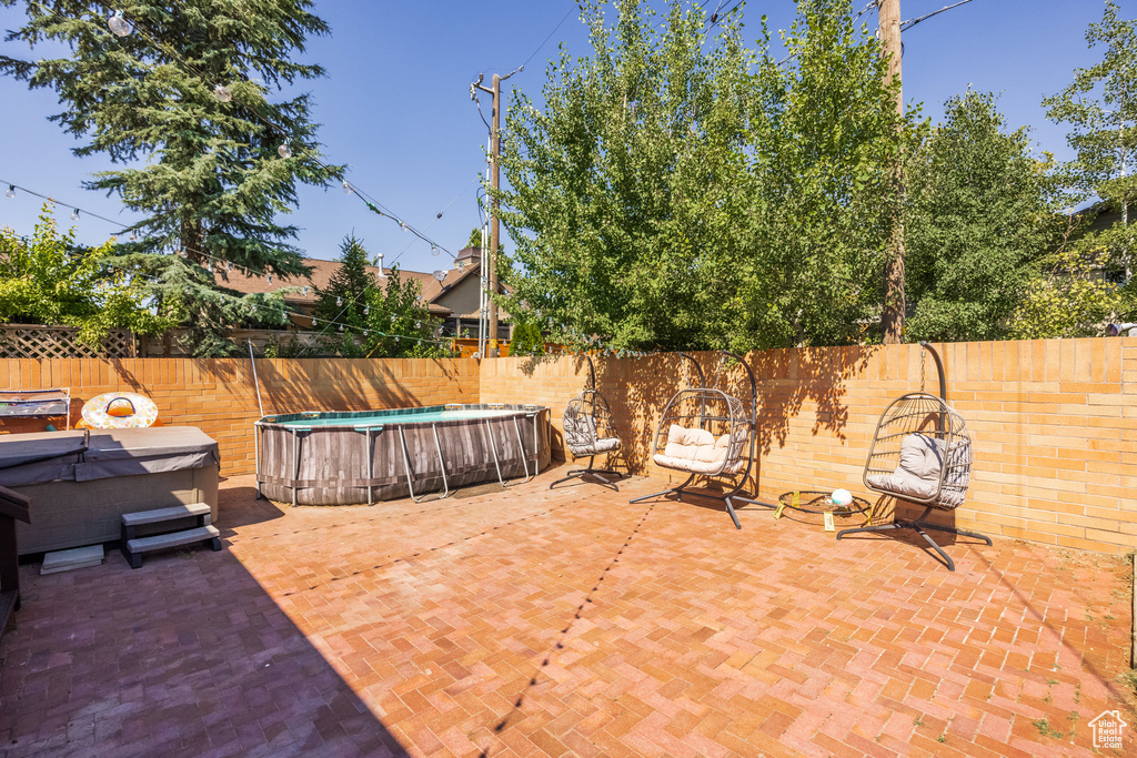 View of patio / terrace featuring a fenced in pool