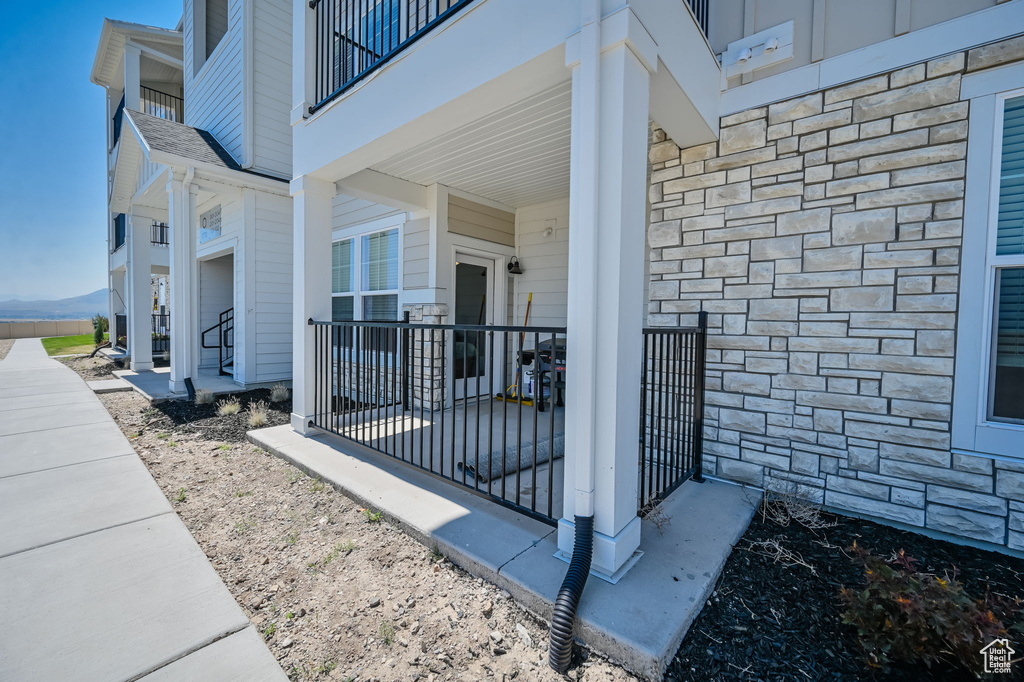 Property entrance featuring a balcony