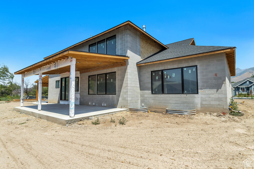 Rear view of property with a patio area