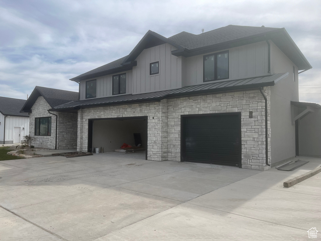 View of side of home featuring a garage