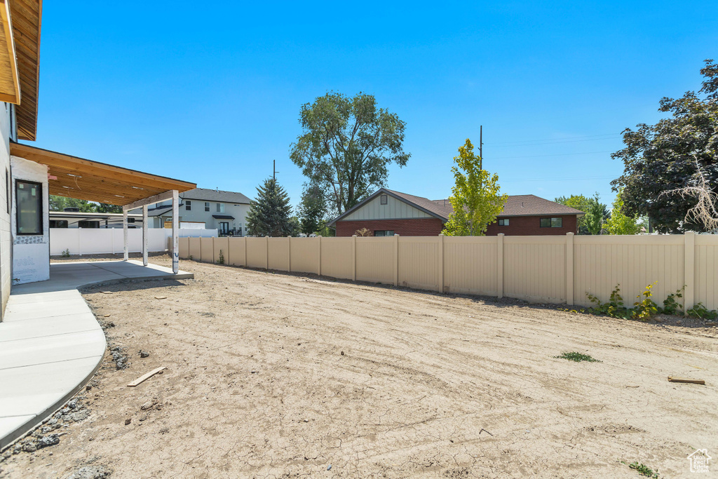 View of yard with a patio area