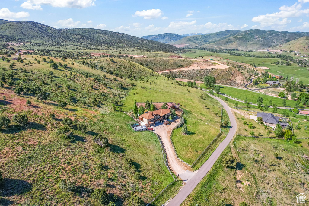 Drone / aerial view with a mountain view and a rural view