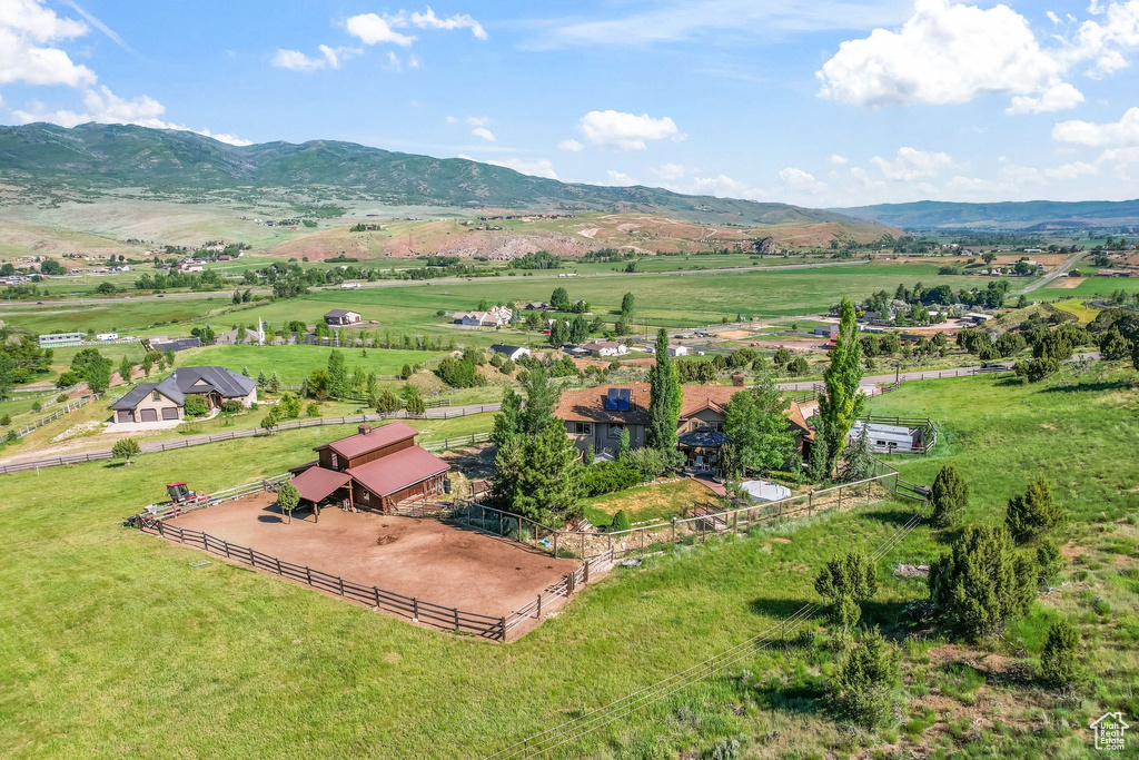 Birds eye view of property featuring a mountain view and a rural view