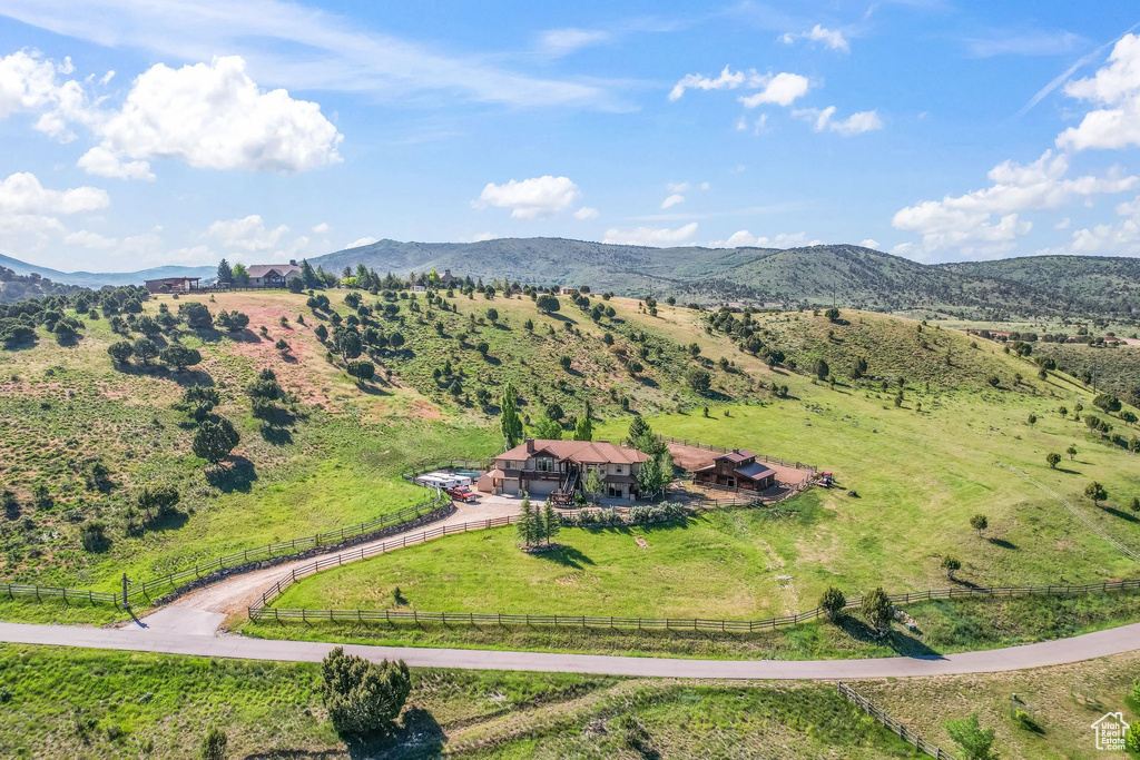 Drone / aerial view with a mountain view and a rural view