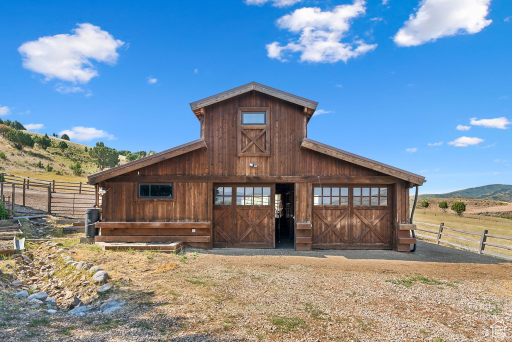 Exterior space with a mountain view and an outbuilding