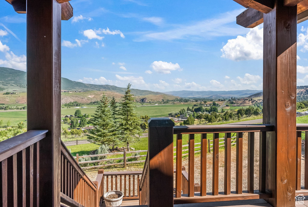 Deck featuring a mountain view and a rural view