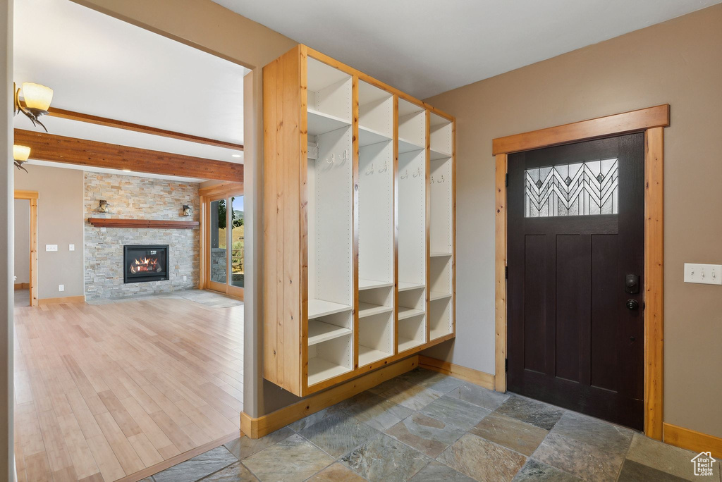 Interior space featuring a stone fireplace and hardwood / wood-style floors