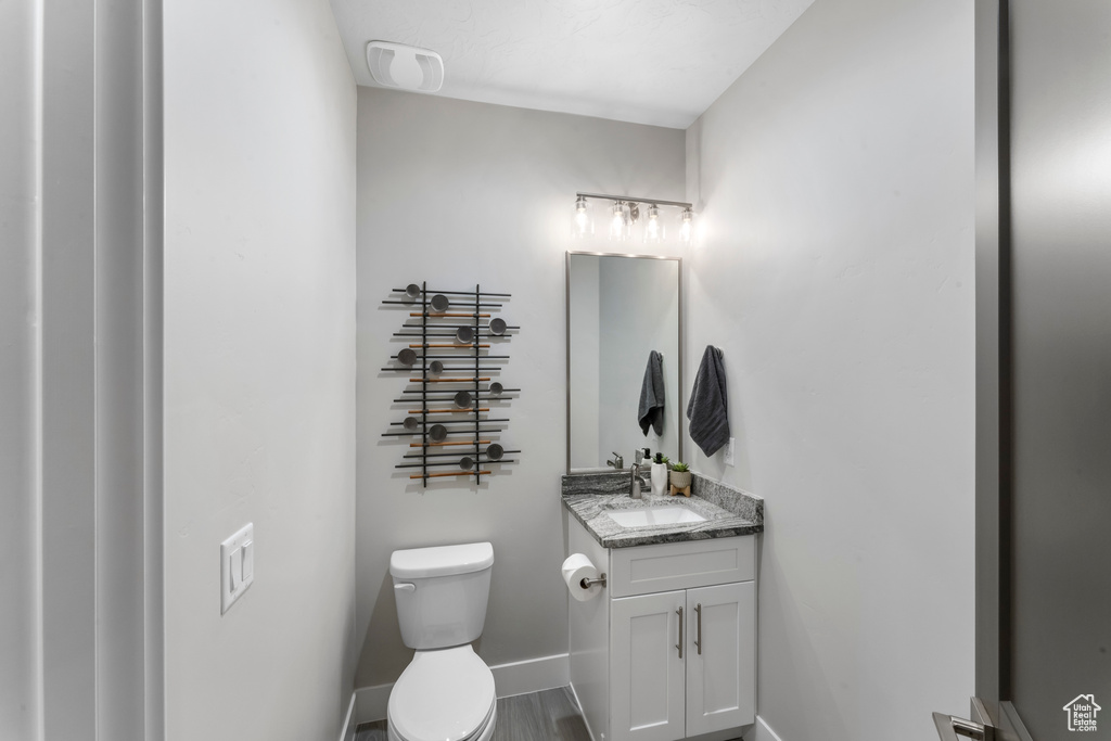 Bathroom with toilet and vanity