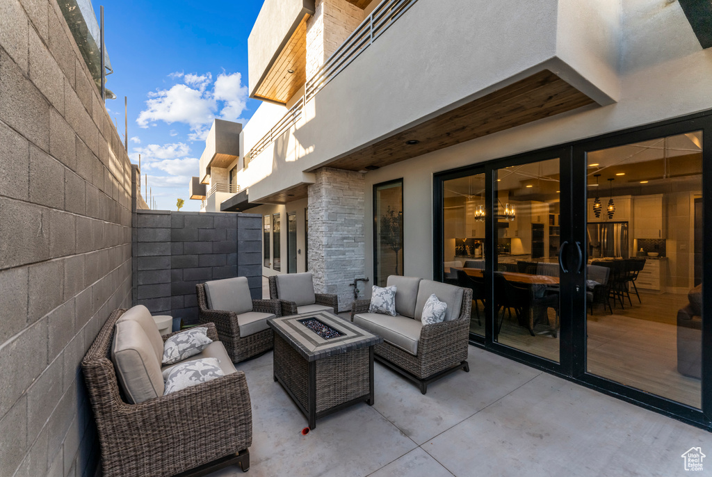 View of patio featuring an outdoor hangout area