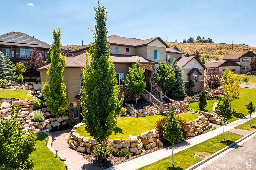 View of front of property with a front lawn