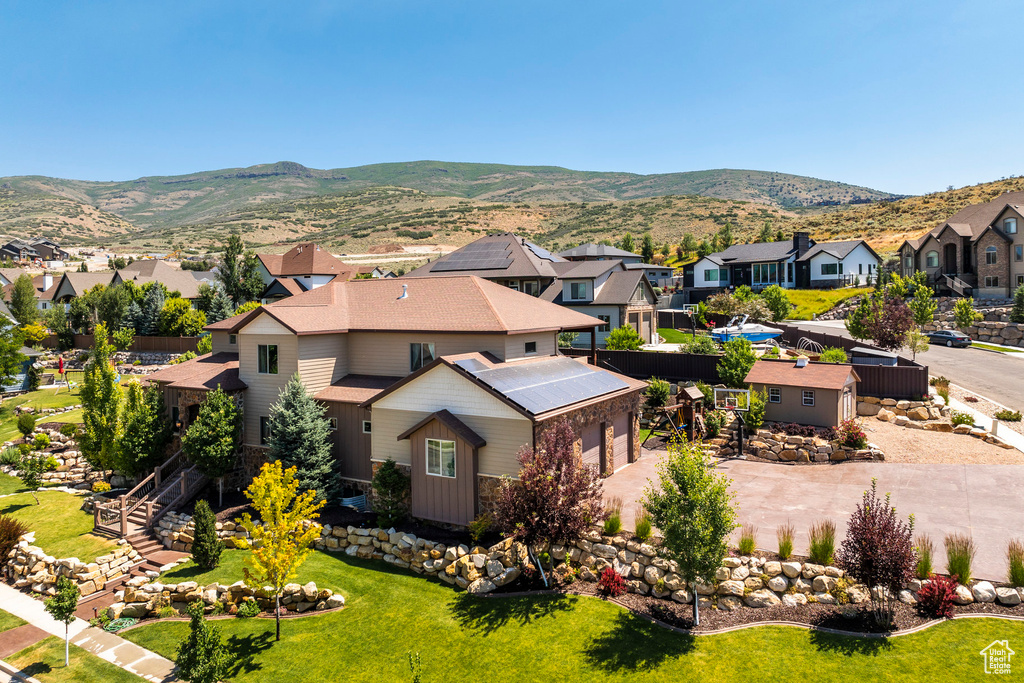 Birds eye view of property with a mountain view